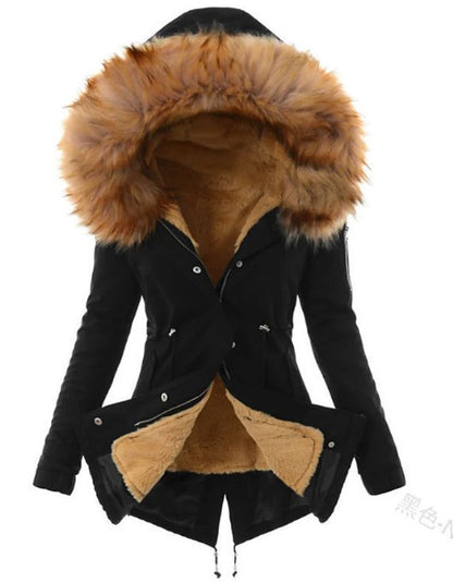 Women's long hooded parka with faux fur trim, worn on model